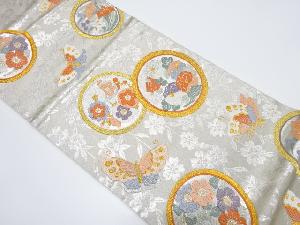 丸紋に蝶模様織り出し袋帯